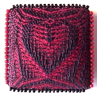 One of the stamp-sized pins