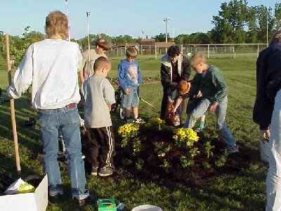 Cub Scout Troop 106 planting flowers